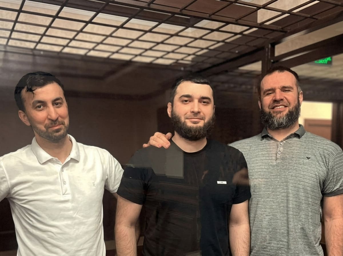 The three men in the courtroom